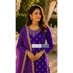 May include: A vibrant purple long-sleeved tunic featuring intricate gold embroidery around the neckline and a repeating gold pattern across the fabric. A matching purple dupatta with a gold-trimmed border is draped over one shoulder. Text reads DESIGNER HARSHA.