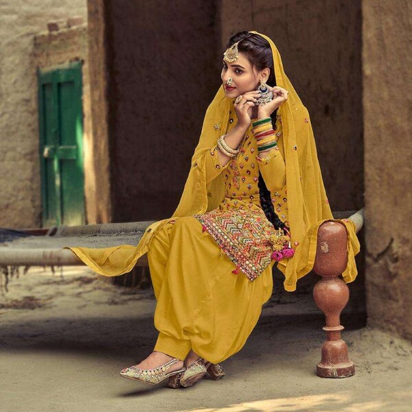 Wondrous Yellow Color Punjabi Lohri Celebration Wear Stylish Dhoti Patiyala Dupatta Dress Fancy Embroidery Handmade Work Salwar Kameez Suits