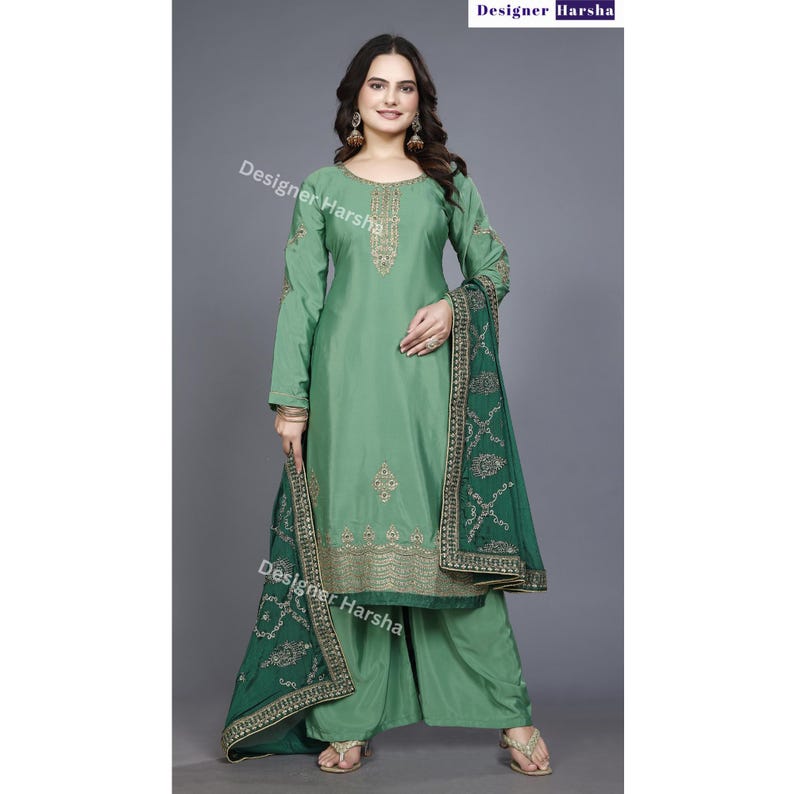 May include: A green salwar kameez with gold embroidery and a matching green dupatta. The dupatta has a gold border and a floral design.