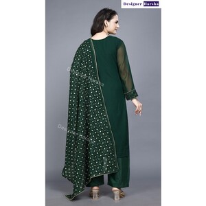 May include: A dark green long-sleeved kurta with a matching palazzo pant and a green dupatta with gold embroidery. The dupatta has a polka dot pattern.