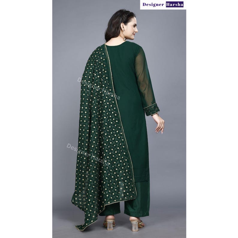 May include: A dark green long-sleeved kurta with a matching palazzo pant and a green dupatta with gold embroidery. The dupatta has a polka dot pattern.
