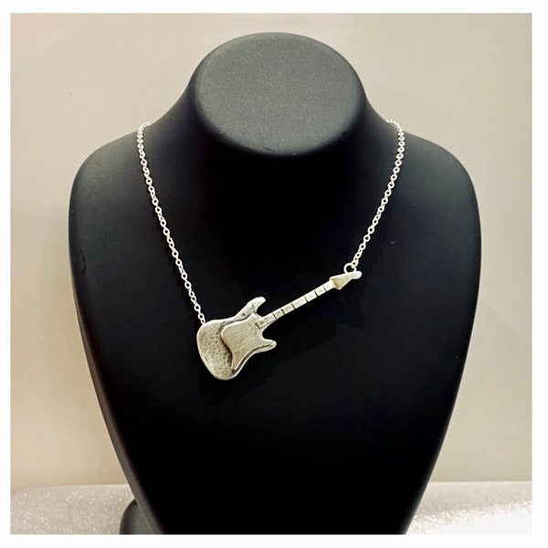 Sterling silver guitar necklace for music fans.