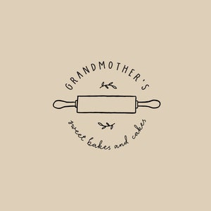 May include: Black and white illustration of a rolling pin with the text "Grandmother's sweet bakes and cakes" around it.