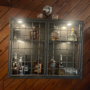 Wall mounted liquor cabinet outlet with lock