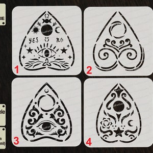 May include: Four white square stencils with black designs of a Ouija board planchette. The stencils are numbered 1 through 4. The text "Reusable Stencil" and "APET 1000 micron (1 mm/40 mil)" is printed on the left side of the image.