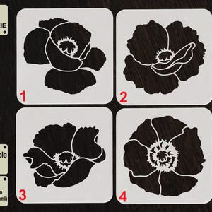 May include: Four white cookie stencils with black poppy flower designs. The stencils are labeled 1 through 4. The text "TOOL FOR COOKIE" is in the top left corner. The text "Reusable Stencil" and "APET 1000 micron (1 mm/40 mil)" is in the bottom left corner.