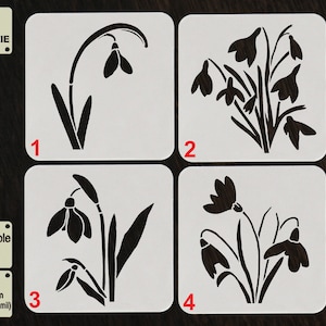 May include: Four reusable plastic stencils for decorating cookies with snowdrop flower designs. The stencils are labeled 1 through 4. The text "TOOL FOR COOKIE" and "Reusable Stencil" are also visible.