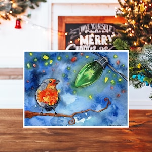 Cartes de Noël : petit oiseau rouge-gorge avec aquarelle de lumière de Noël. Intérieur vierge, 5 x 7, paquet de cartes de Noël fait main. Jours fériés