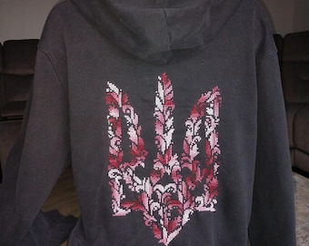 May include: Black hooded sweatshirt with a pink and white embroidered Ukrainian trident on the back.