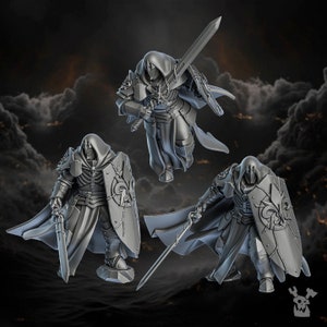 May include: Three gray plastic miniature figures of hooded knights with swords and shields. The knights are posed in different fighting stances.