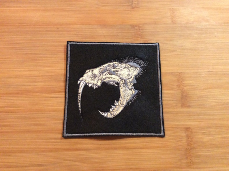 Embroidered Sabertooth Tiger Skull Patch SewIron-On by Twistedstitcher 2018 Located in Abbotsford BC Canada