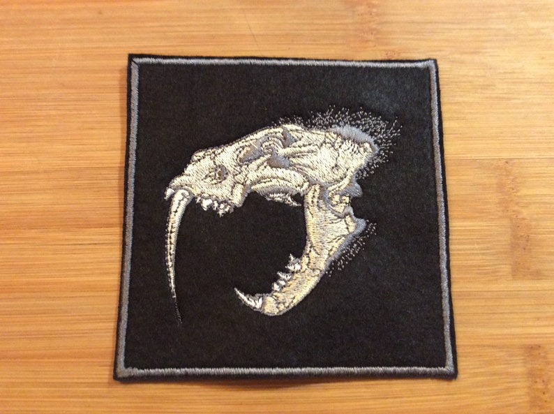Embroidered Sabertooth Tiger Skull Patch SewIron-On by Twistedstitcher 2018 Located in Abbotsford BC Canada