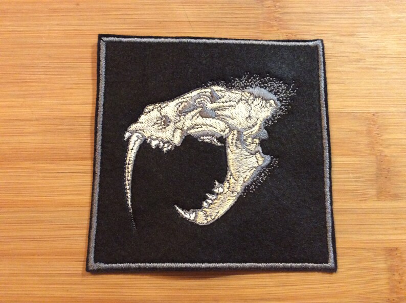 Embroidered Sabertooth Tiger Skull Patch SewIron-On by Twistedstitcher 2018 Located in Abbotsford BC Canada