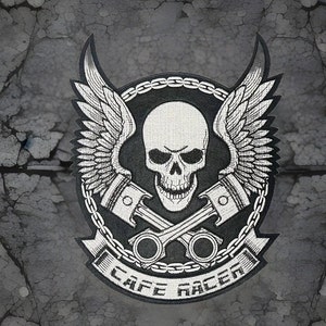 May include: Embroidered patch featuring a skull with wings, crossed pistons, and the text "CAFE RACER" in a banner. The design is primarily black and white, with detailed stitching and a biker theme.
