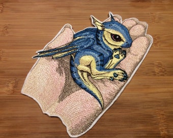 Embroidered Blue and Yellow Winged Baby Dragon in Hand Sew/Iron-On Patch by Twistedstitcher 2018 Located in Abbotsford BC Canada