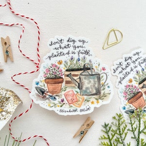 May include: A watercolor sticker with a gardening theme. The sticker features a quote by Elisabeth Elliot: "Don't dig up what you planted in faith." The sticker also features a watering can, flower pots, and gardening tools.