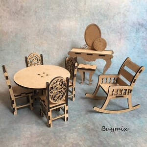 May include: A wooden dollhouse furniture set featuring a round table, four chairs, a rocking chair, a vanity table with a mirror, and a small side table. The furniture is made from unfinished wood and has a natural wood colour.