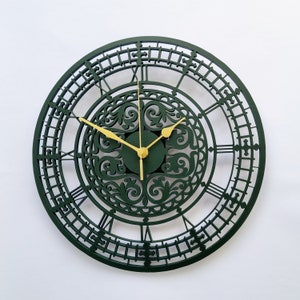 May include: A green clock with gold hands and Roman numerals. The clock face has a decorative, intricate design.