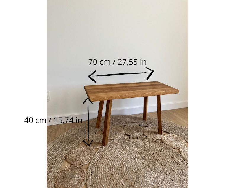 May include: A rectangular wooden bench with four straight legs. The bench features a natural wood grain finish. Text on the image indicates a length of 27.55 inches and a height of 15.74 inches, providing clear dimensions for this furniture piece.