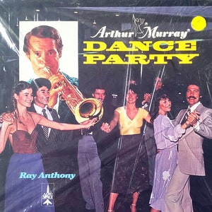 May include: A vintage record album cover featuring a band playing music. The album cover is yellow, black, and white with the text "Arthur Murray Dance Party" and "Ray Anthony".