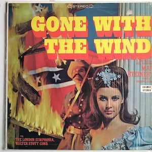 May include: A vintage vinyl record album cover featuring a dramatic scene from the movie Gone With The Wind. The cover art depicts a woman in a blue dress with a Confederate flag burning in the background. The album features the complete original score by Max Steiner and is performed by The London Symphony Orchestra, conducted by Walter Stott.
