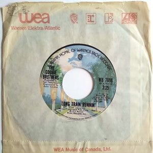 The Doobie Brothers - Long Train Runnin&#39; / Vinyl- 7&quot;- 45 RPM Record / *Original 1973 Warner Bros. Records Single / WEA Sleeve / *NEW_LIKE*