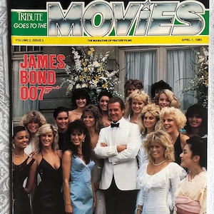 V. RARE* 1985 Tribute Goes to the Movies Magazine - April 1 / Cover: Roger Moore & Bond Girls / *Original / Vintage / Collectible / *MINT*