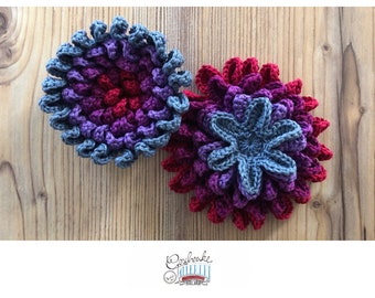 Crocheted cervix flower in blue, purple and red tones - birth preparation - tools for pregnancy, midwives and doulas