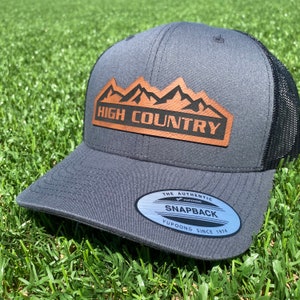 Charcoal High Country Trucker Hat. Chevrolet High Country Leather patch hat. Chevy High Country Cap. Snapback.
