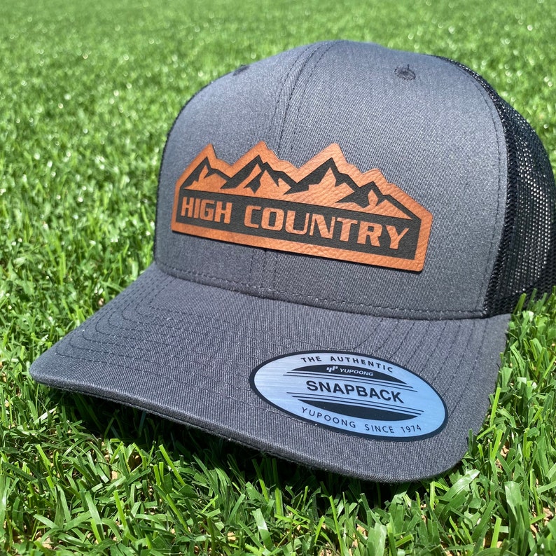 Charcoal High Country Trucker Hat. Chevrolet High Country Leather patch hat. Chevy High Country Cap. Snapback.