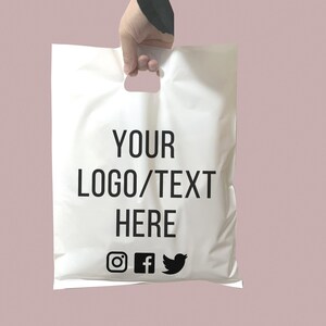 May include: White plastic shopping bag with black text that says "YOUR LOGO/TEXT HERE" and social media icons for Instagram, Facebook, and Twitter.