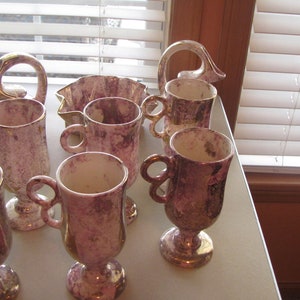 9-Piece homemade pottery set. 6 handled cups, 2-creamer pitchers, 1- candy dish