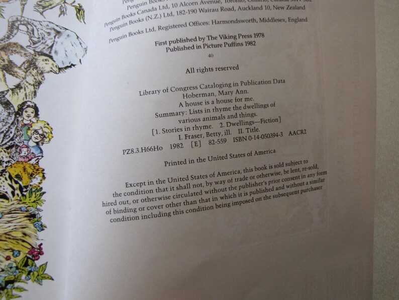 May include: A book page with text, including the title "A house is a house for me" and the author's name, Mary Ann Hoberman. The page also includes publishing information and a summary of the book's contents.