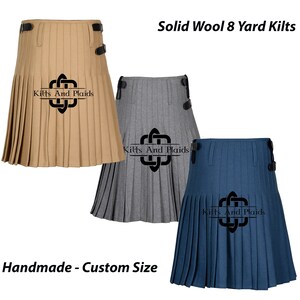 May include: Three 8-yard kilts in different colors: tan, gray, and blue. The kilts are made of solid wool and have a pleated design. The kilts are handmade and can be custom sized. The text "Kilts And Plaids" is printed on each kilt.
