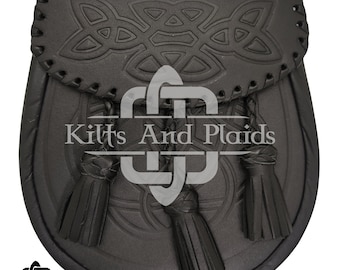 May include: Black leather sporran with Celtic knotwork design and three tassels. The sporran features a flap closure and decorative stitching. The text "Kilts And Plaids" is visible on the front.