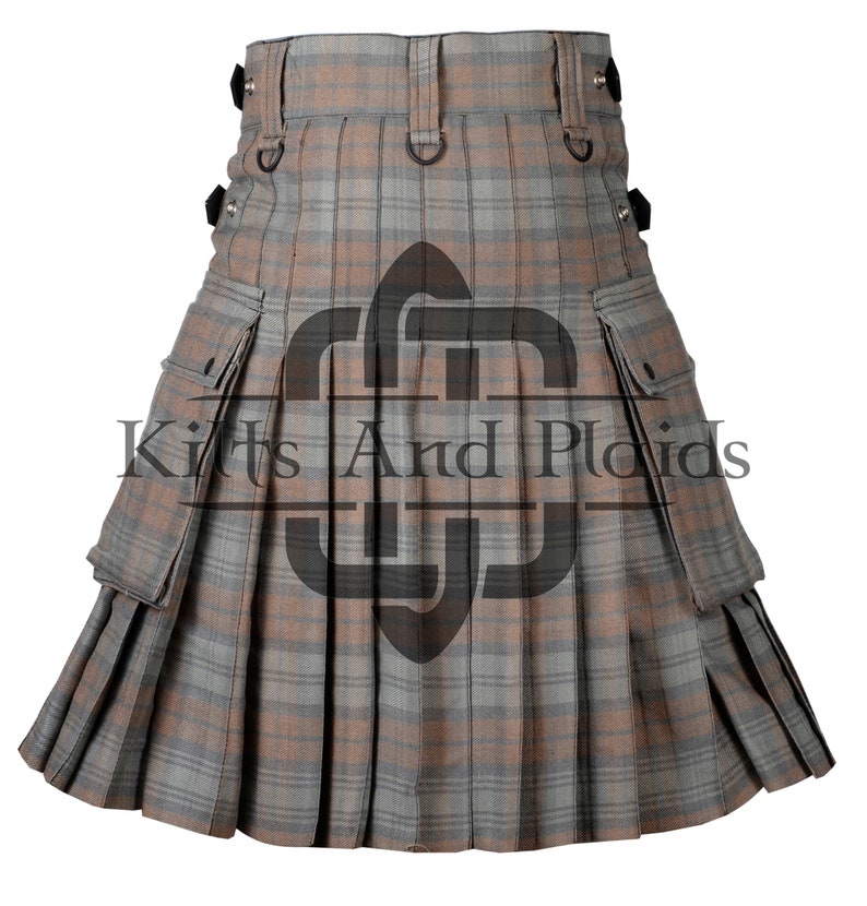 May include: A brown and grey utility kilt with multiple pockets and a plaid pattern. The kilt has a black buckle and strap closure.
