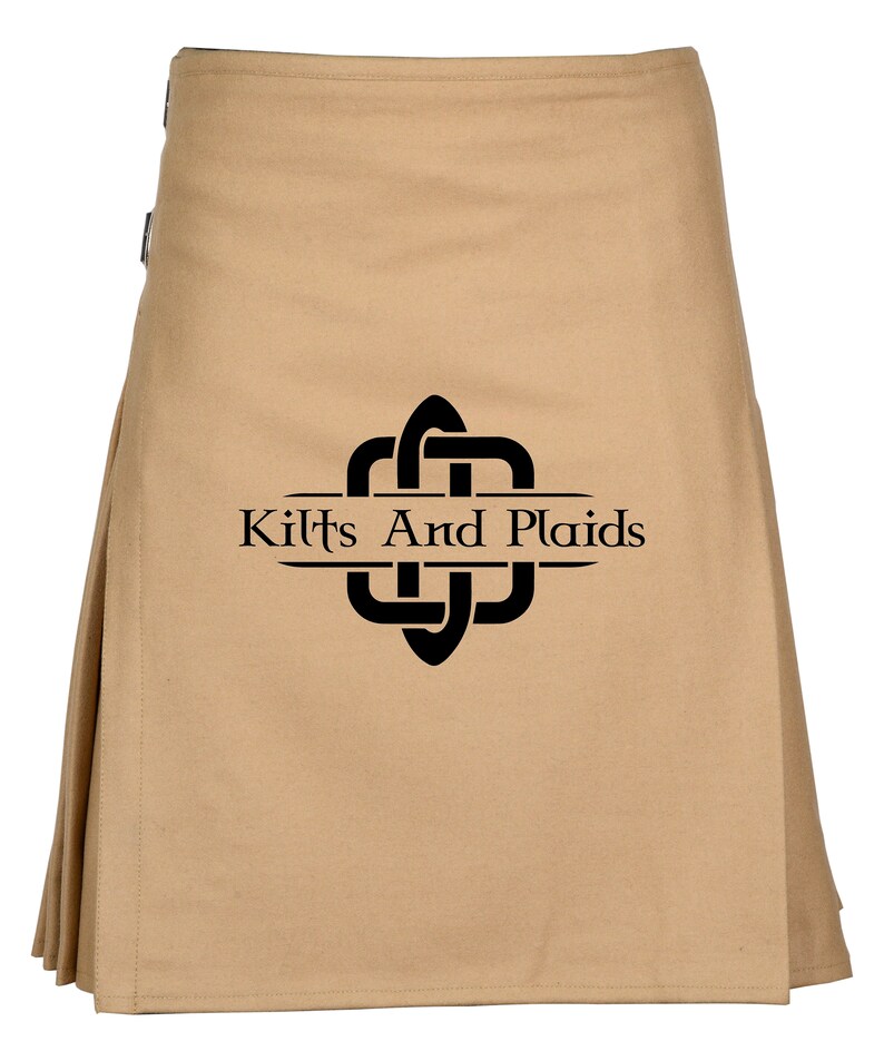 May include: A tan kilt with a black Celtic knot design and the text "Kilts And Plaids" in a banner.