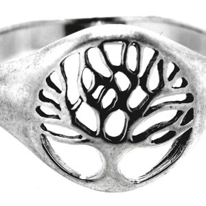 May include: A silver ring with a tree of life design. The tree is cut out of the ring, creating a delicate and intricate design.