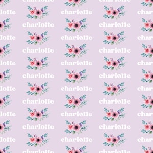 May include: A seamless pattern featuring the name "charlotte" repeated in white text on a light purple background. Each name is accompanied by a watercolor illustration of a pink and purple floral bouquet.