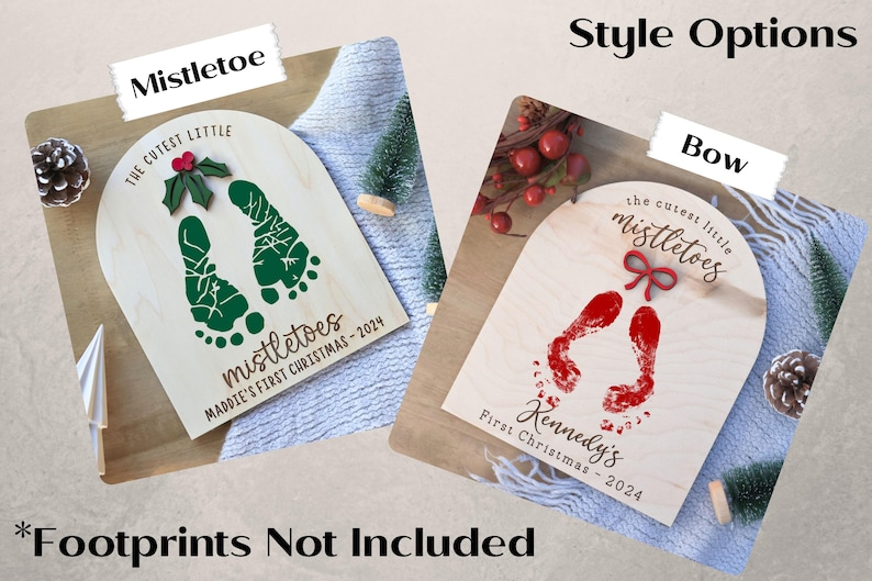 May include: Two wooden signs with the text "the cutest little mistletoes" and a pair of footprints. One sign has a green mistletoe with red berries and the other has a red bow. The text "Maddie's First Christmas - 2024" and "Kennedy's First Christmas - 2024" are on the signs.
