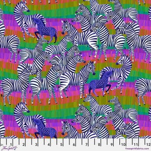 May include: A vibrant fabric design featuring numerous zebras with black and white stripes, set against a colorful background of purple, green, and orange stripes. Some zebras are a blue color with white polka dots. The image includes a ruler with inch measurements.