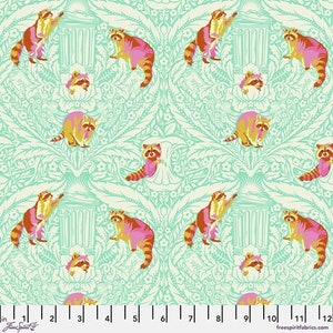 May include: A repeating pattern of raccoons in shades of pink, yellow, and orange on a light teal background. The raccoons are interspersed with stylized trash cans and floral elements. The fabric has a whimsical, illustrative style.
