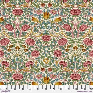 May include: A fabric with a repeating floral pattern. The design features large, pink roses, yellow tulips, and green leaves on a cream background. The pattern includes birds and vines, with a ruler along the bottom showing inches.