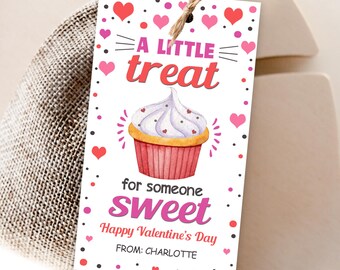 May include: A Valentine's Day gift tag with a cupcake illustration. The tag reads "A Little Treat for someone Sweet" with hearts and dots. The tag is attached to a burlap bag with a twine tie.