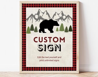 Puede incluir: Un letrero enmarcado con un borde a cuadros rojo y negro. El letrero presenta una silueta de oso negro, montañas grises y árboles verdes. Las palabras "CUSTOM SIGN" se muestran en negrita, con el texto "Edit the text yourself and print unlimited signs" debajo.