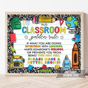 May include: A framed classroom poster with a black and white composition notebook border. The poster features colorful illustrations of school supplies and the text "Our Classroom Golden Rule" with a list of guidelines for students.