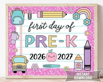 May include: A rectangular sign with a pink speckled border featuring the text first day of PRE-K 2026 2027. The design includes illustrations of a light blue backpack, yellow pencil, rainbow, school bus, pink apple, purple crayon, and flowers.