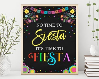 May include: A black chalkboard sign with a colorful floral border and the text "No time to Siesta, It's time to Fiesta".
