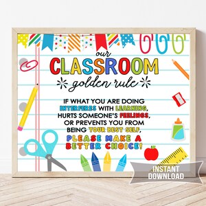 May include: A framed classroom sign with the text "Our Classroom Golden Rule." The sign features colorful illustrations of school supplies like pencils, scissors, and crayons. The text emphasizes positive behavior and making good choices.