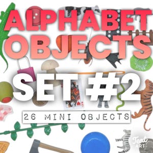 May include: A collection of 26 miniature objects including a green lizard, pink padlock, wooden mushroom, playing card, tiger figurine, zebra, blue sphere, and various plastic items. The image features the text ALPHABET OBJECTS SET #2.